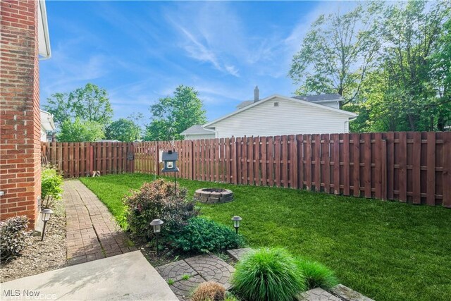 37 Monticello Dr, Brunswick, OH 44212 - view of yard featuring an outdoor fire pit