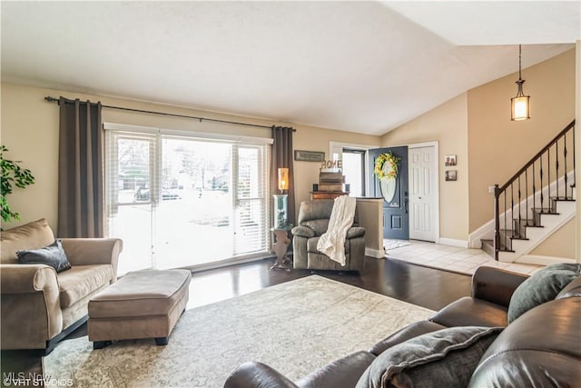 37 Monticello Dr, Brunswick, OH 44212 - living area with plenty of natural light, lofted ceiling, stairway, and baseboards