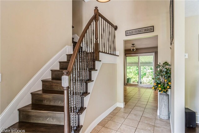 37 Monticello Dr, Brunswick, OH 44212 - stairs featuring tile patterned floors, baseboards, and a high ceiling