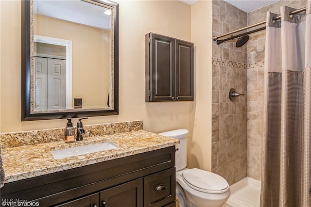37 Monticello Dr, Brunswick, OH 44212 - bathroom featuring toilet, vanity, and tiled shower