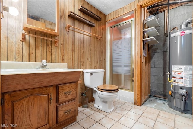 bathroom with gas water heater, toilet, a stall shower, tile patterned flooring, and wooden walls