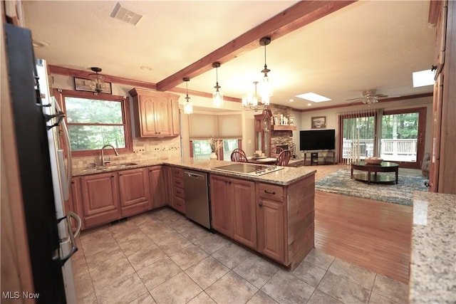 6191 Root Rd, Spencer, OH 44275 - kitchen with stainless steel dishwasher, a sink, electric cooktop, open floor plan, and crown molding