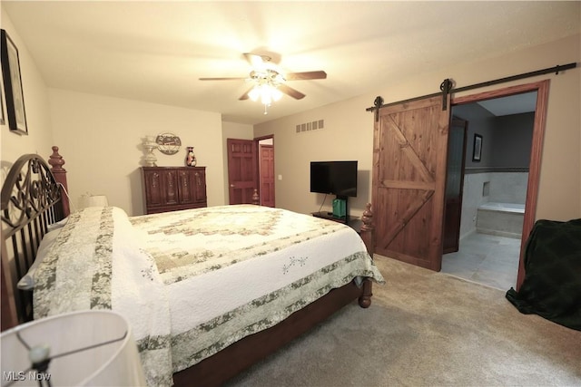 6191 Root Rd, Spencer, OH 44275 - carpeted bedroom featuring a barn door, a ceiling fan, and ensuite bath