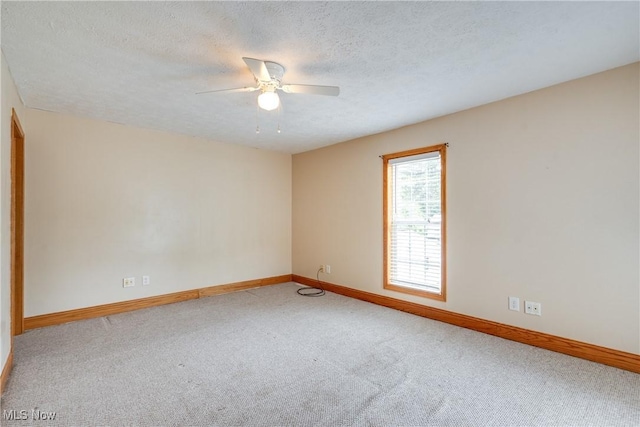 146 E Bergey St, Wadsworth, OH 44281 - carpeted spare room featuring ceiling fan, baseboards, and a textured ceiling