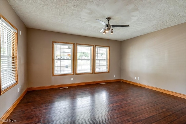 146 E Bergey St, Wadsworth, OH 44281 - unfurnished room with a textured ceiling, hardwood / wood-style flooring, ceiling fan, and baseboards