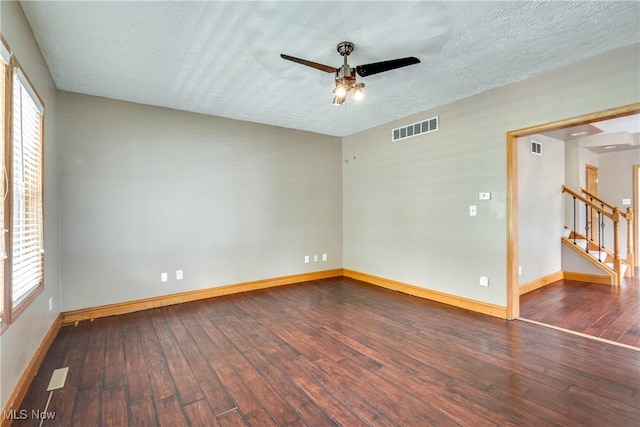 146 E Bergey St, Wadsworth, OH 44281 - spare room with ceiling fan, wood-type flooring, baseboards, a textured ceiling, and stairs