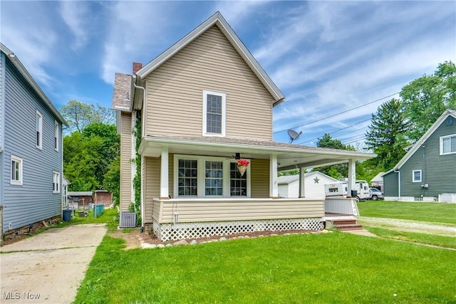146 E Bergey St, Wadsworth, OH 44281 - view of front facade featuring a porch, cooling unit, a front lawn, driveway, and a chimney