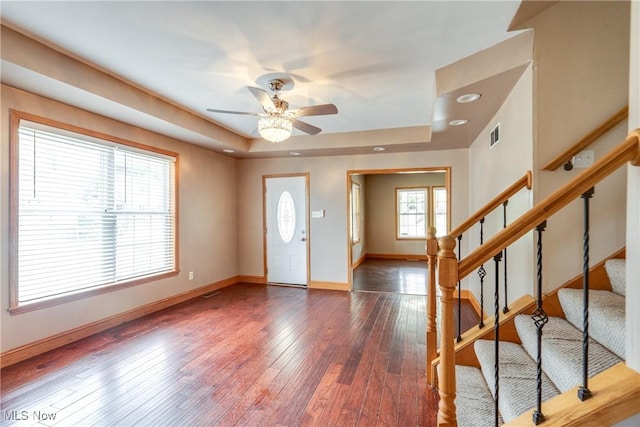 146 E Bergey St, Wadsworth, OH 44281 - entryway featuring baseboards, a ceiling fan, stairs, wood-type flooring, and a tray ceiling