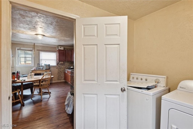 3074 Erin Ave, Cleveland, OH 44113 - washroom with a textured ceiling, washer and clothes dryer, dark wood-type flooring, and a desk