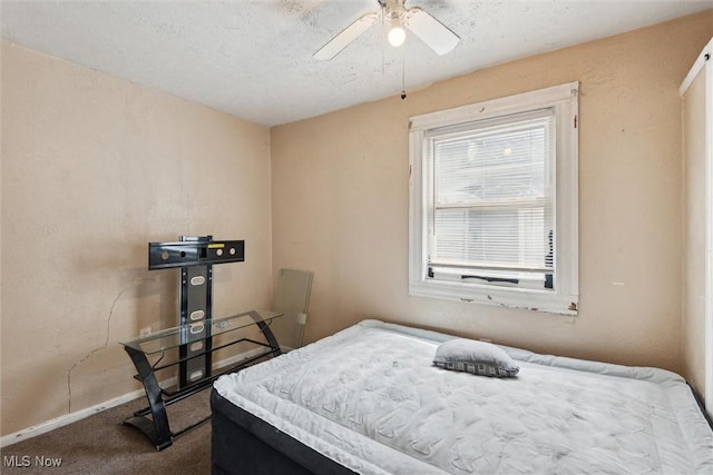 3074 Erin Ave, Cleveland, OH 44113 - carpeted bedroom featuring baseboards, ceiling fan, and a textured ceiling
