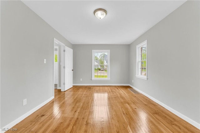 563 E 260th St, Euclid, OH 44132 - empty room with light wood finished floors and baseboards