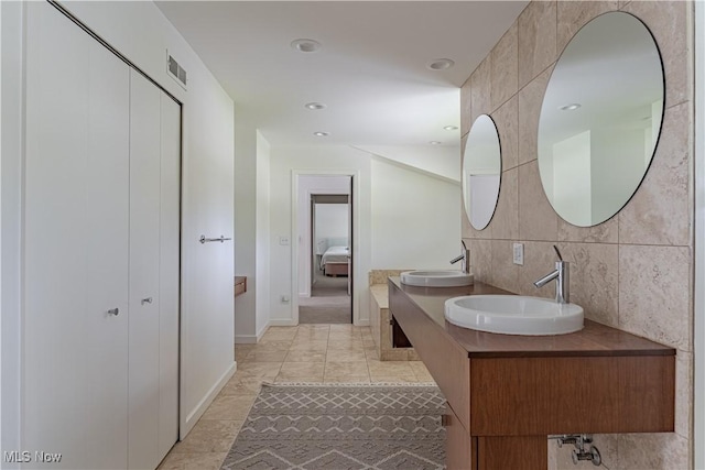 2471 Snowberry Ln, Pepper Pike, OH 44124 - bathroom featuring double vanity and backsplash
