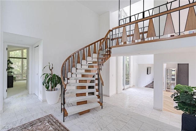 2471 Snowberry Ln, Pepper Pike, OH 44124 - staircase featuring a high ceiling and marble look tile flooring