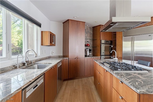 2471 Snowberry Ln, Pepper Pike, OH 44124 - kitchen with stainless steel appliances, extractor fan, light wood-type flooring, and brown cabinets