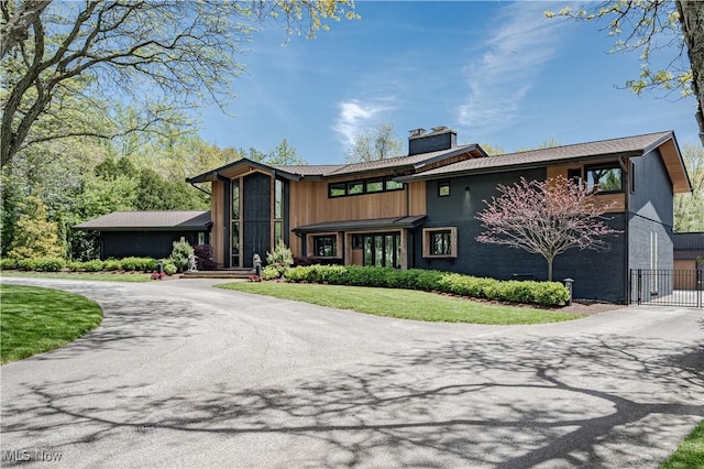 2471 Snowberry Ln, Pepper Pike, OH 44124 - view of front of property featuring curved driveway, a chimney, and a gate