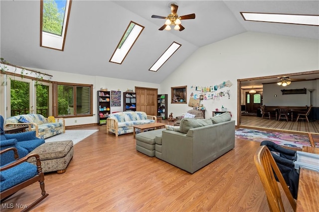 41972 Griswold Rd, Elyria, OH 44035 - living room featuring a skylight, a ceiling fan, high vaulted ceiling, and plenty of natural light