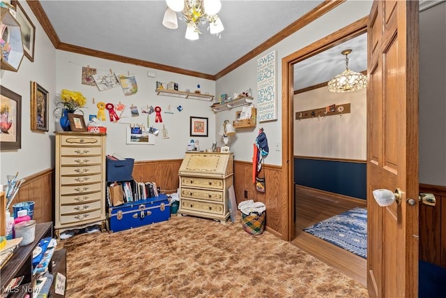 41972 Griswold Rd, Elyria, OH 44035 - bedroom featuring a chandelier, wainscoting, ornamental molding, wooden walls, and wood finished floors