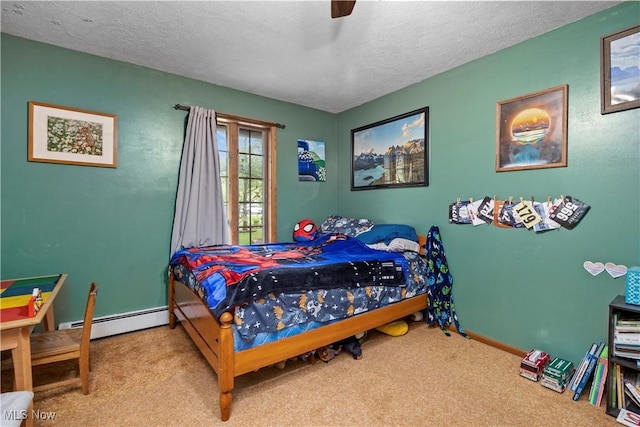 41972 Griswold Rd, Elyria, OH 44035 - bedroom featuring a baseboard radiator, carpet flooring, a textured ceiling, baseboards, and a ceiling fan