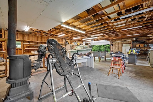41972 Griswold Rd, Elyria, OH 44035 - garage featuring freestanding refrigerator and a workshop area
