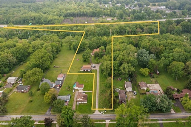 41972 Griswold Rd, Elyria, OH 44035 - aerial overview of property's location with property parcel outlined and a heavily wooded area