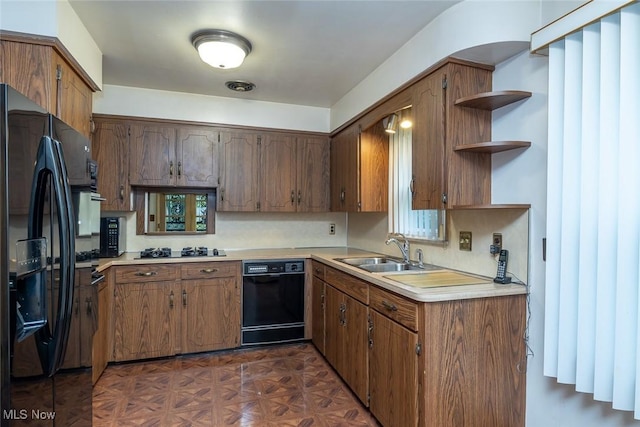 2639 Whiton Rd, University Heights, OH 44118 - kitchen with black appliances, a sink, open shelves, and light countertops