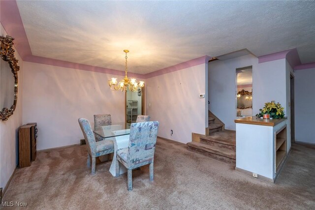 2639 Whiton Rd, University Heights, OH 44118 - dining room with carpet, stairway, a chandelier, and a textured ceiling
