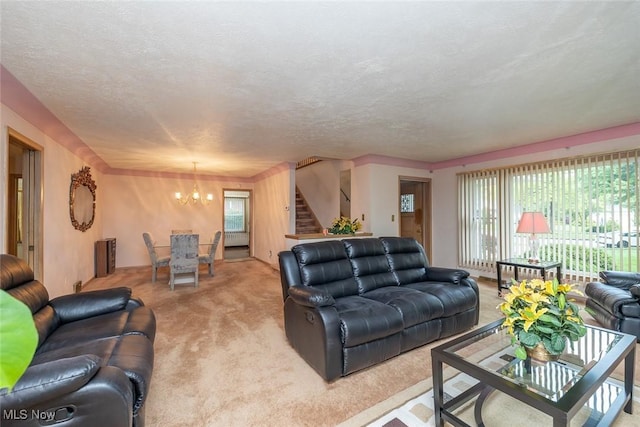 2639 Whiton Rd, University Heights, OH 44118 - living area featuring light colored carpet, stairs, a chandelier, and a textured ceiling
