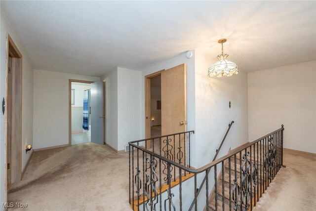 2639 Whiton Rd, University Heights, OH 44118 - corridor with an upstairs landing and carpet