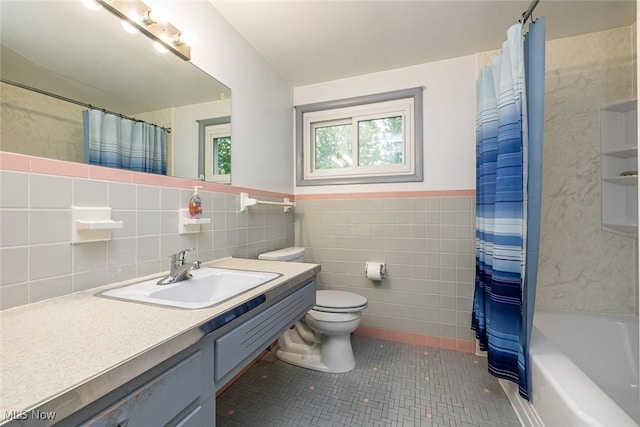 2639 Whiton Rd, University Heights, OH 44118 - full bath featuring tile walls, toilet, tile patterned flooring, vanity, and wainscoting