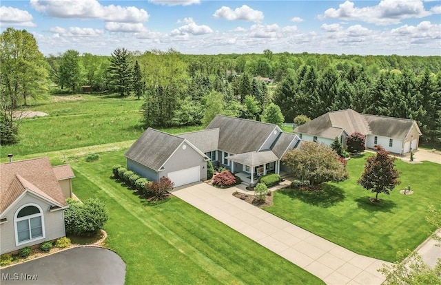 view of subject property featuring a heavily wooded area