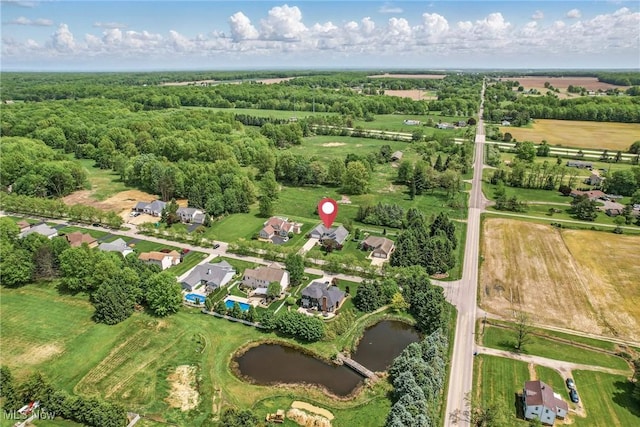 aerial view of property's location featuring a large body of water
