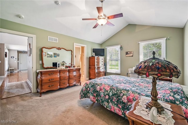 bedroom with lofted ceiling, carpet floors, ceiling fan, and baseboards