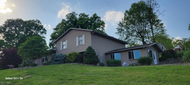 61426 Stillmeadow Ln, New Concord, OH 43762 - view of property exterior with a lawn