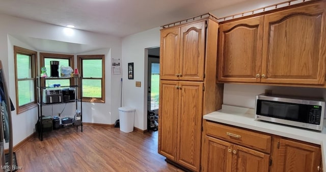 61426 Stillmeadow Ln, New Concord, OH 43762 - kitchen featuring stainless steel microwave, wood finished floors, light countertops, baseboards, and recessed lighting