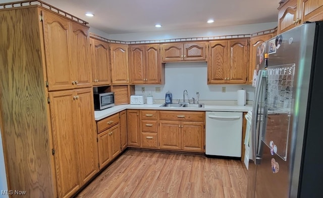 61426 Stillmeadow Ln, New Concord, OH 43762 - kitchen with stainless steel appliances, a sink, light wood-style flooring, light countertops, and recessed lighting