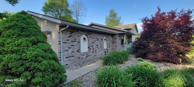61426 Stillmeadow Ln, New Concord, OH 43762 - view of home's exterior with brick siding