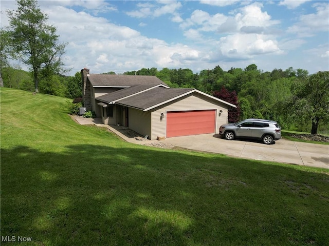 61426 Stillmeadow Ln, New Concord, OH 43762 - view of front of home featuring a garage, a chimney, a front yard, concrete driveway, and a shingled roof