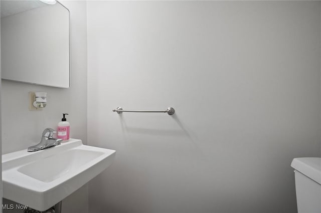 bathroom with a sink and toilet