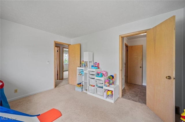 bedroom with carpet flooring and baseboards