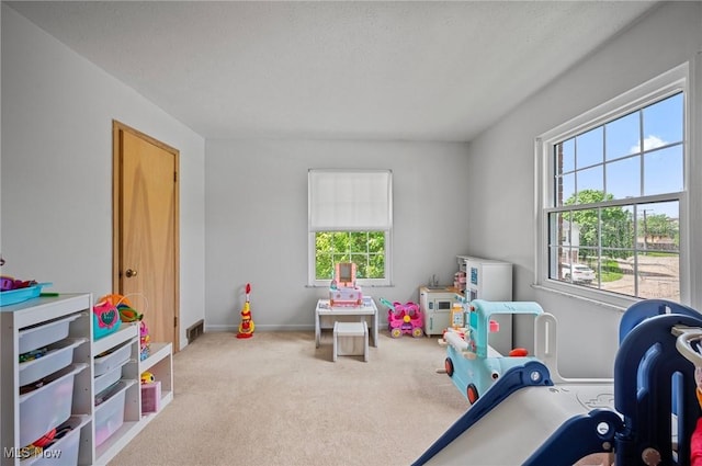 game room with carpet floors and baseboards