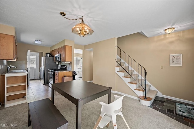 dining area with stairs, a chandelier, baseboards, and light tile patterned floors