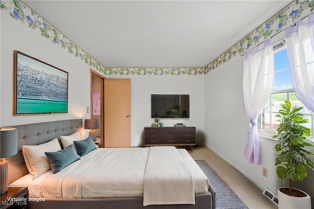 bedroom featuring baseboards