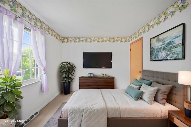 bedroom featuring carpet flooring and baseboards