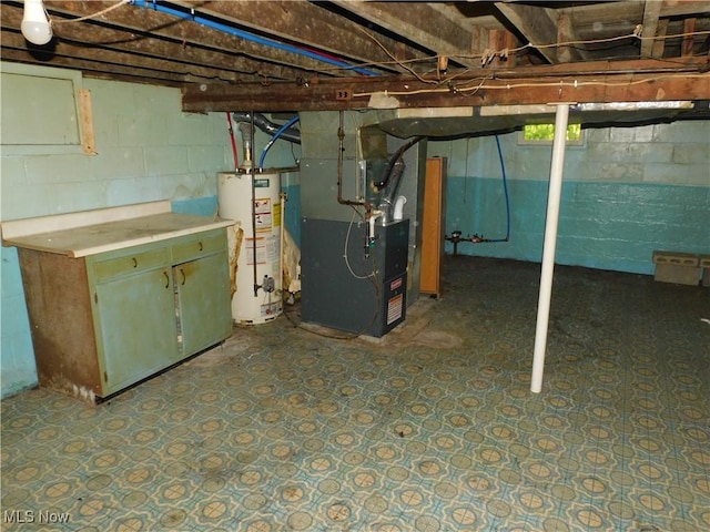 unfinished basement with water heater and heating unit
