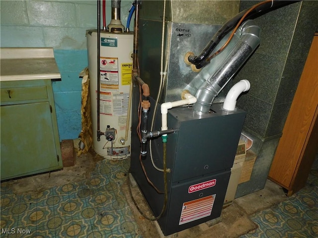 utility room featuring water heater and heating unit