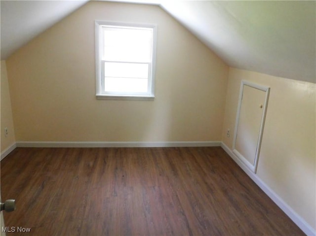 bonus room with wood finished floors, lofted ceiling, and baseboards