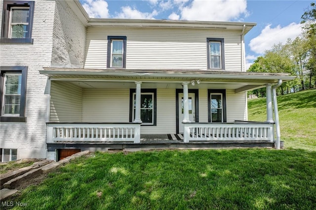 3153 SW Boltz Orchard Rd, Sugarcreek, OH 44681 - view of front of property with a porch and a front yard