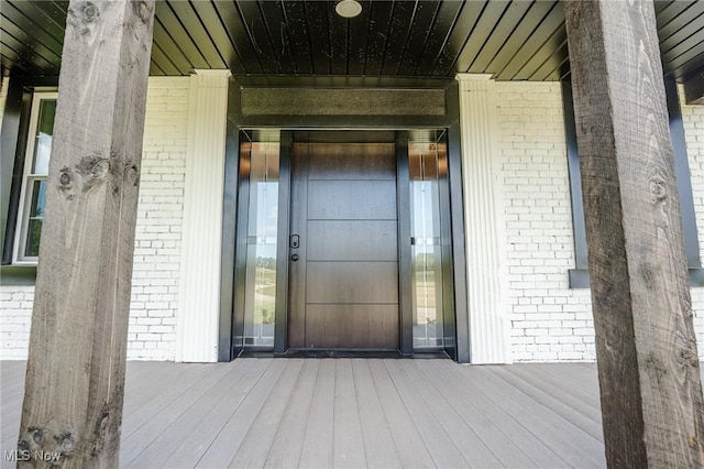 3153 SW Boltz Orchard Rd, Sugarcreek, OH 44681 - doorway to property with brick siding