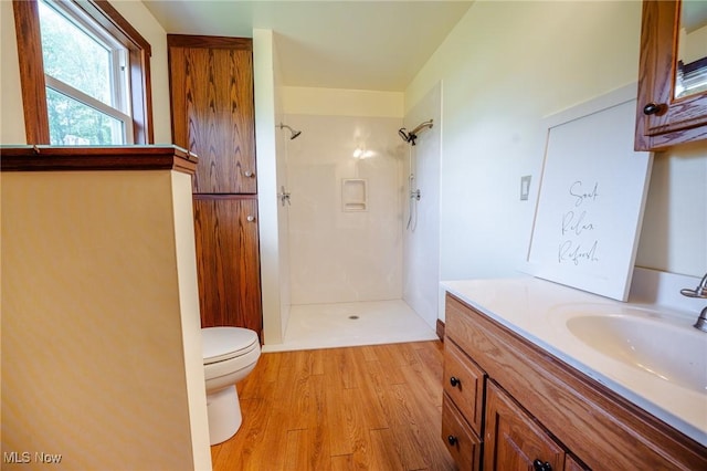 3153 SW Boltz Orchard Rd, Sugarcreek, OH 44681 - full bath featuring a shower, toilet, wood finished floors, and vanity