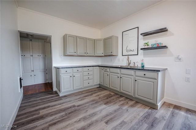 3153 SW Boltz Orchard Rd, Sugarcreek, OH 44681 - kitchen featuring crown molding, light wood finished floors, baseboards, and open shelves